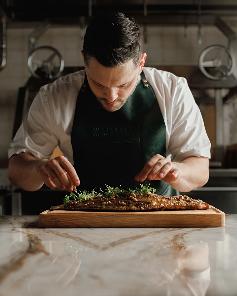Chef Eliano Crespi cooking fish