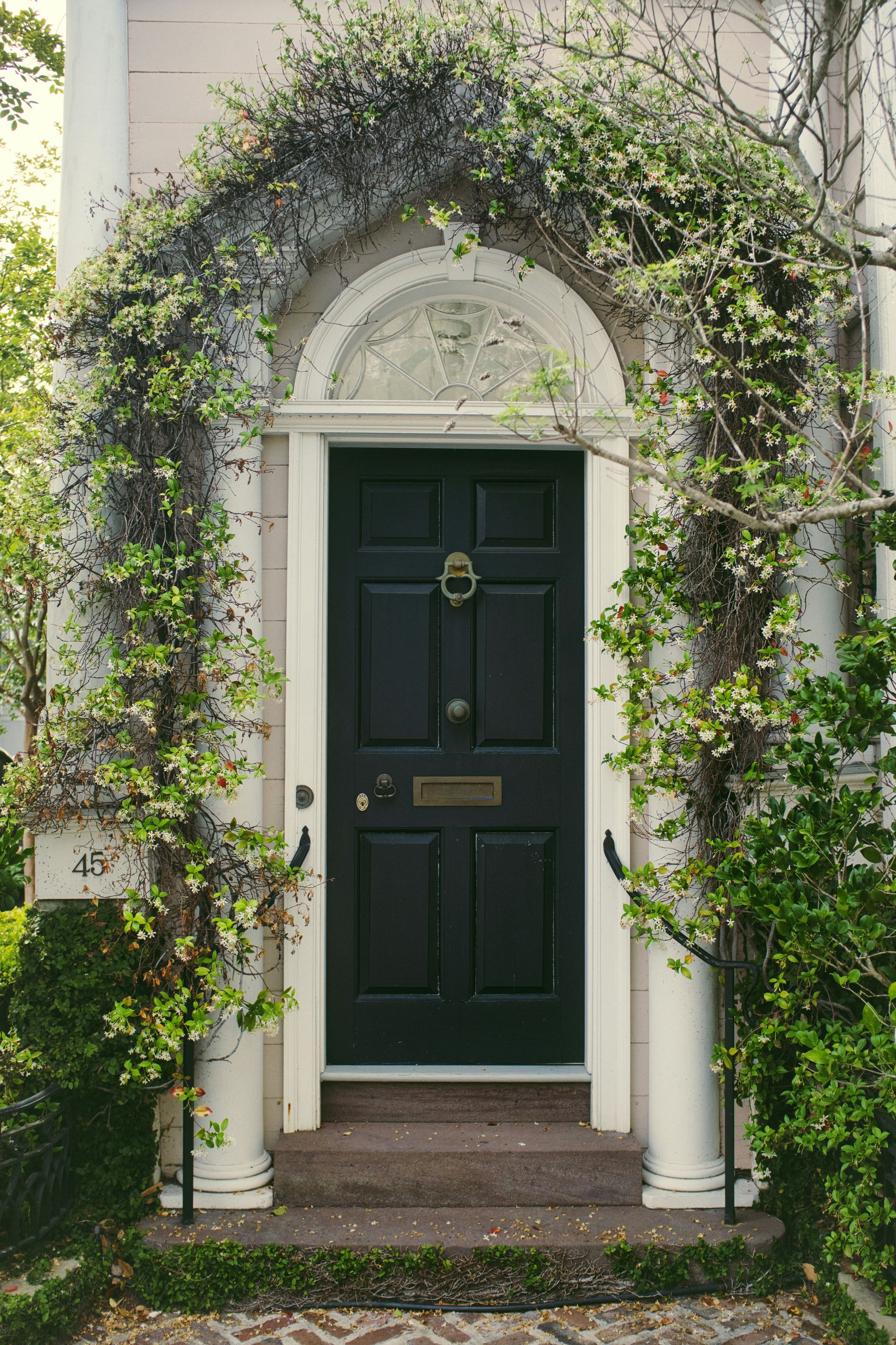 front door with flowers