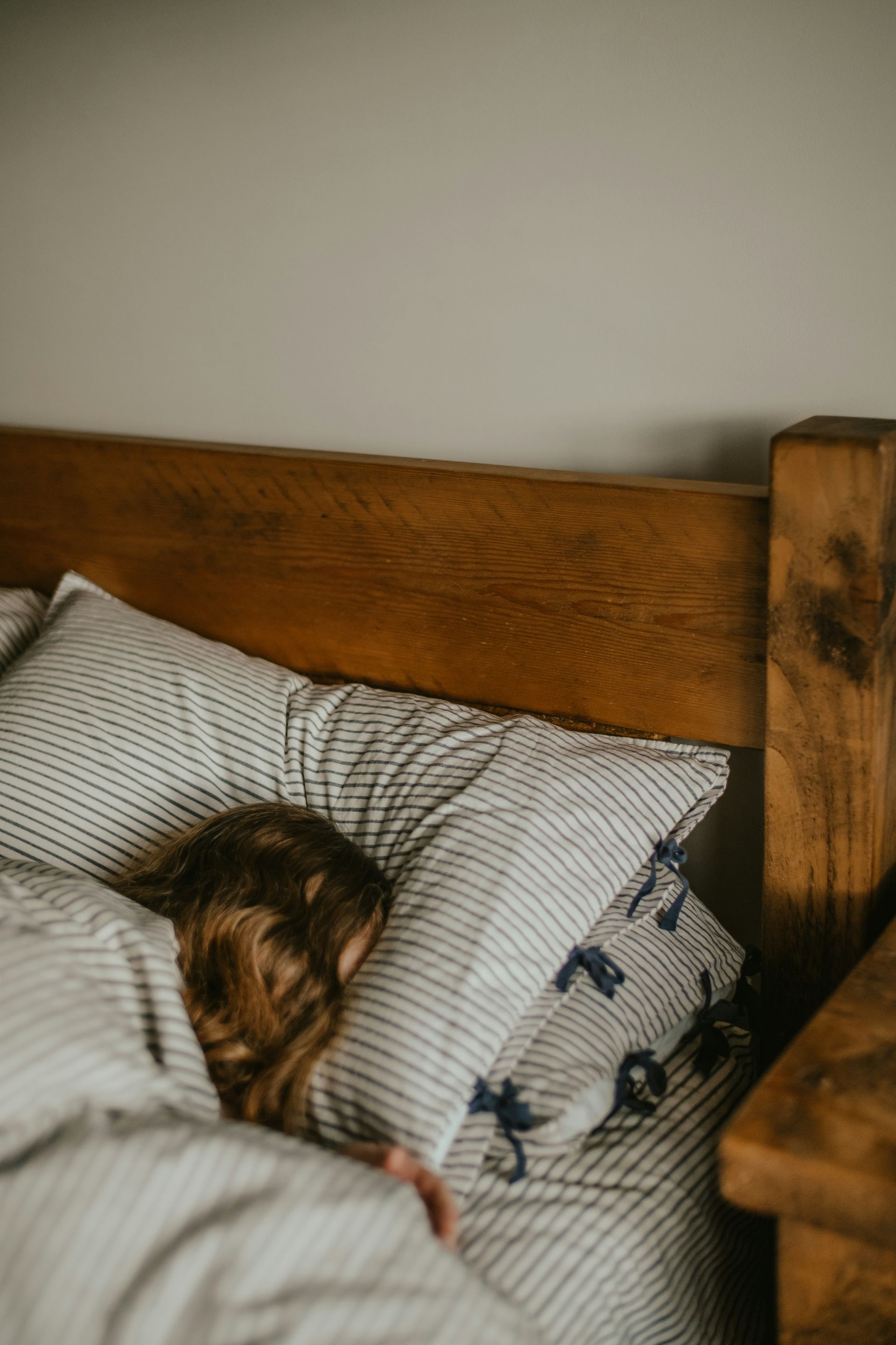 woman sleeping wooden bed